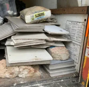 Construction and Renovation Debris Removal – MA Junk Removal & Cleaning Services Stacked construction materials and renovation debris ready for removal