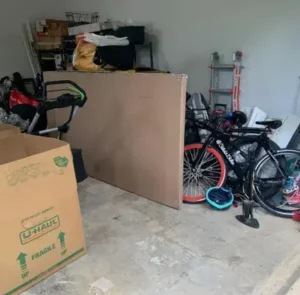 Garage and Storage Junk Removal – MA Junk Removal & Cleaning Services Cardboard boxes and cluttered junk inside garage and storage area