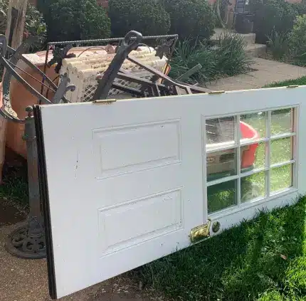 Junk and Furniture Removal in Annandale – MA Junk Removal & Cleaning Services Old door, metal frame, and discarded furniture set out for junk removal in Annandale VA