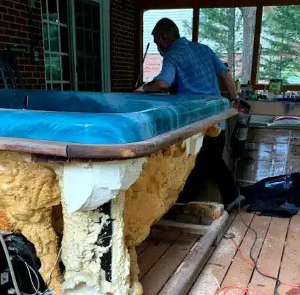 Hot Tub Removal in Annandale – MA Junk Removal & Cleaning Services Technician dismantling old hot tub for removal in Annandale VA