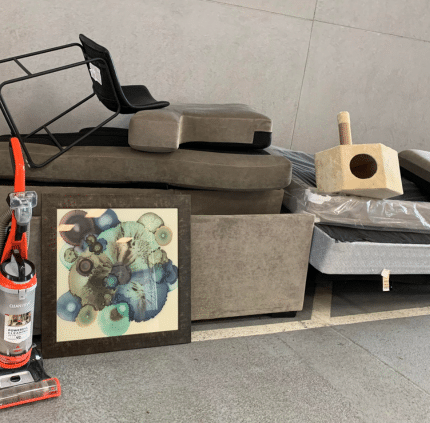 Couches, painting, and vacuum left for pickup in Arlington home