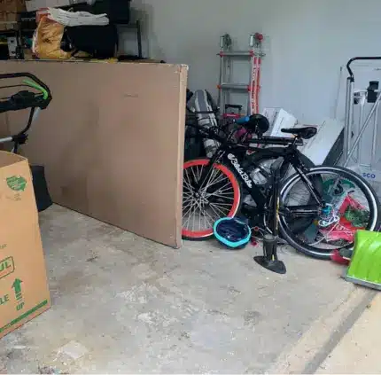 Garage Junk Removal Annandale VA bicycles and large cardboard in an Annandale VA garage ready for removal