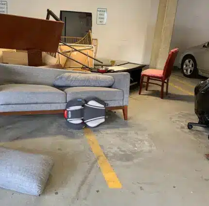parking garage with sofa and household junk placed for pickup in McLean Virginia