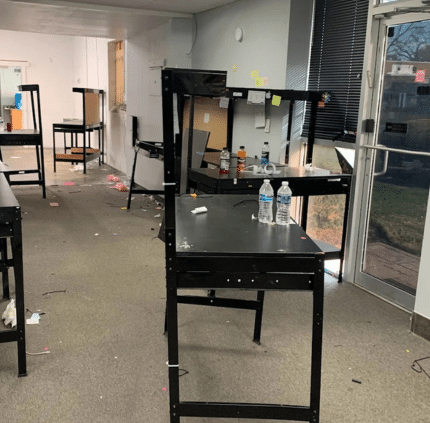 Office junk cleanup in Annandale showing desks, clutter, and leftover items in a commercial space