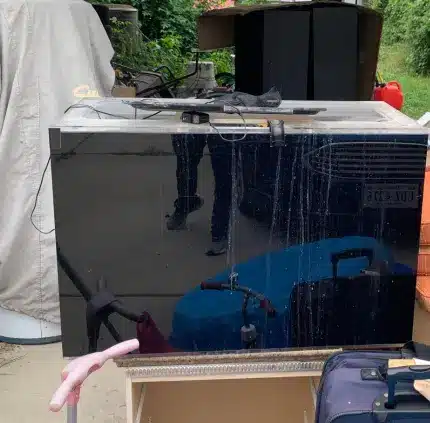 Flat-screen TV and discarded electronics prepared for junk removal in Woodbridge VA