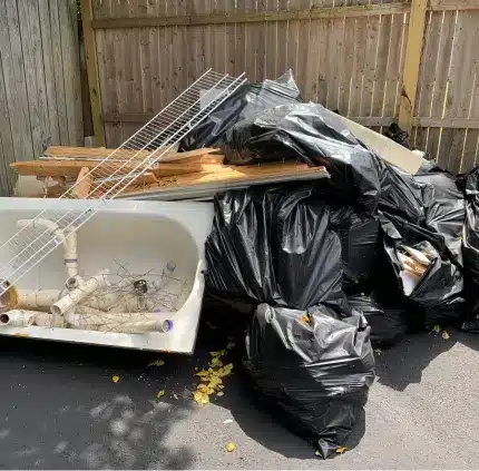 Yard Junk Removal Centreville VA Yard junk removal in Centreville VA with bagged debris, old fixtures, and outdoor waste ready for disposal